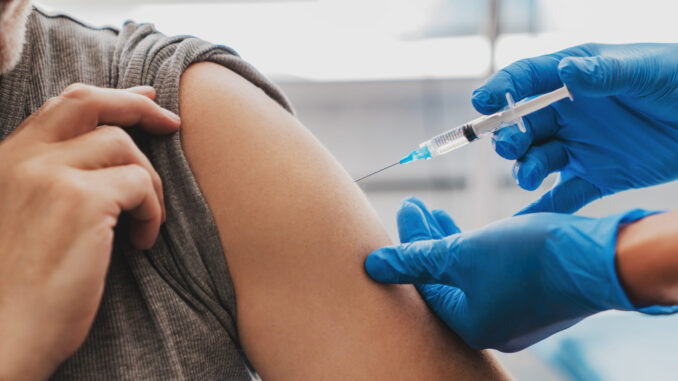 Vaccination of senior person in hospital