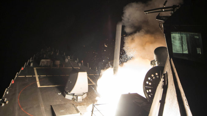 U.S. Navy guided-missile destroyer USS Ross (DDG 71) fires a tomahawk land attack missile in Mediterranean Sea
